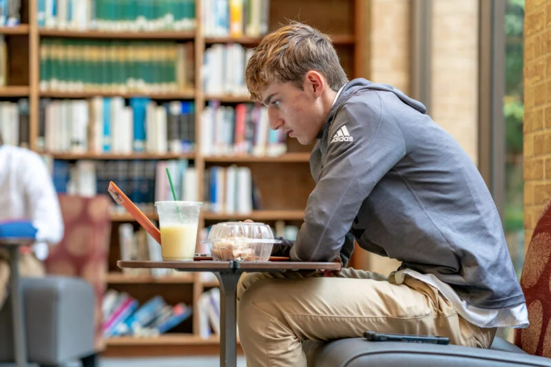 Student studying in the Upper School Library