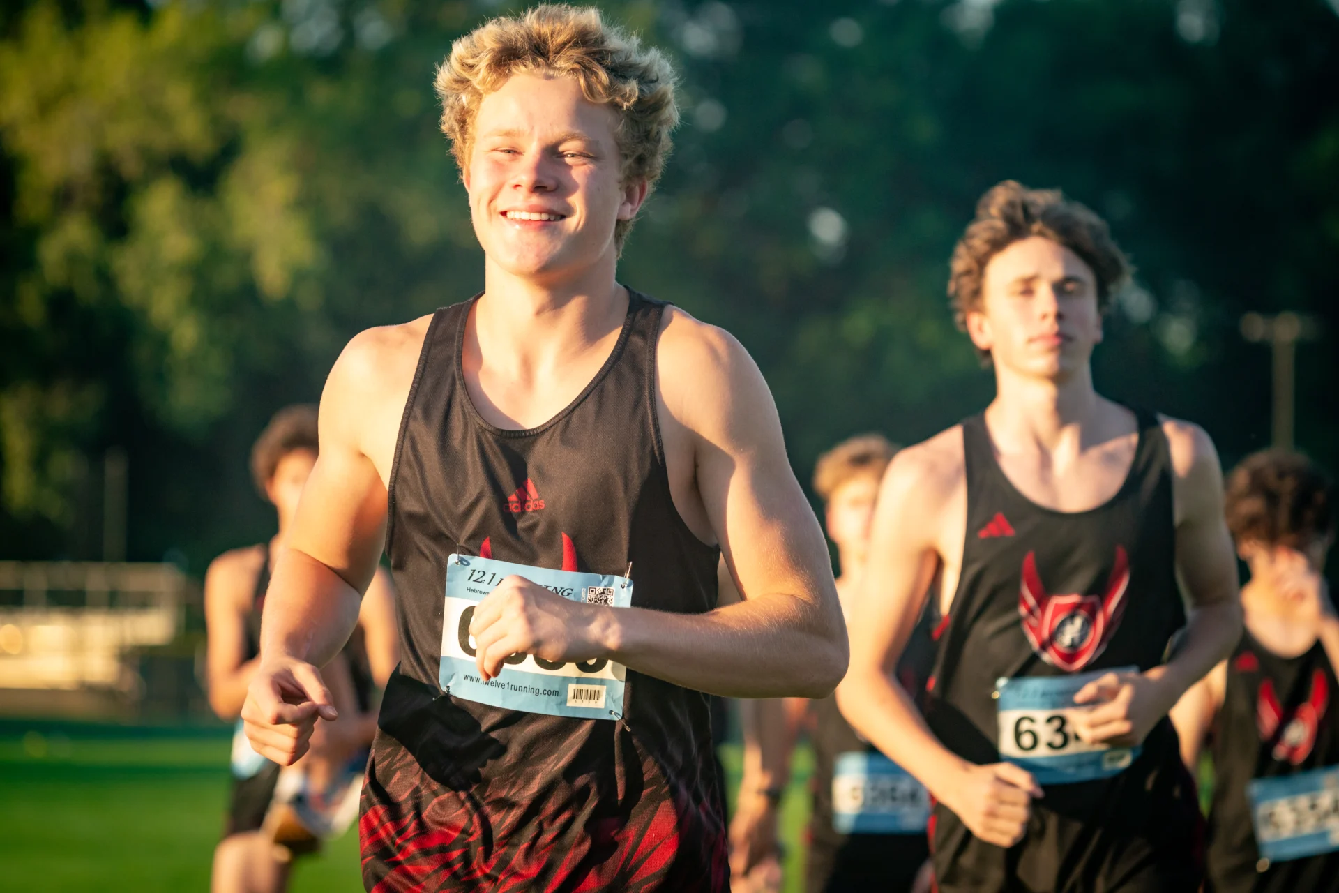 Student running in a Cross Country meet.